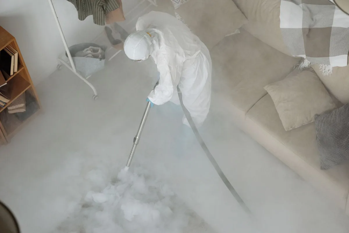 Biohazard cleanup technician in protective equipment, Kaukauna, WI